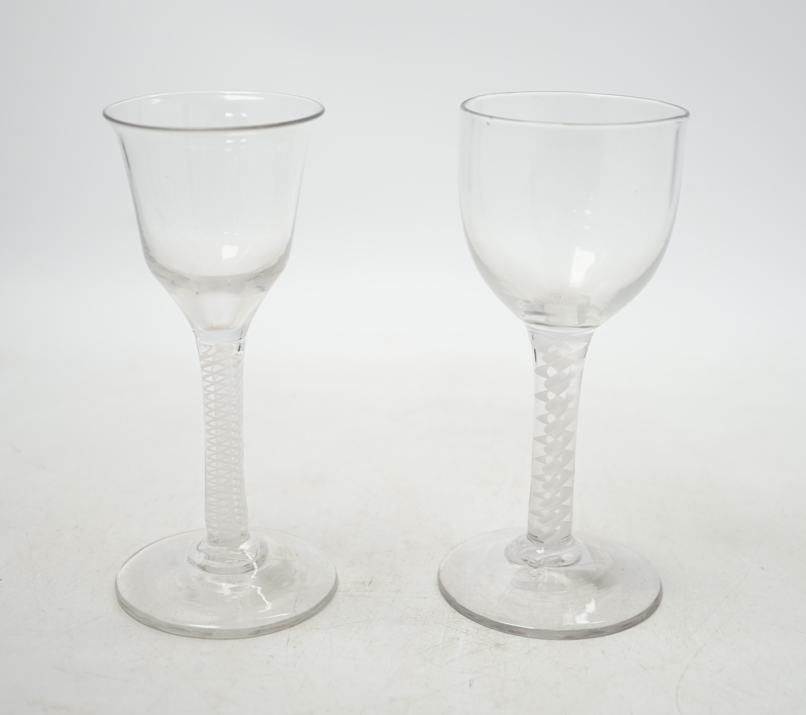 Two mid-18th century opaque twist cordial glasses, 15cm. Condition - good